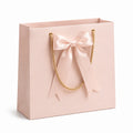 Geschenktüte 32 x 12 x 26 cm Papier Rosa mit Kordelhenkeln und Schleife